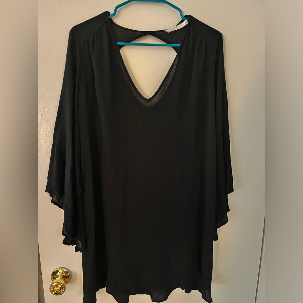 Loose flowy black mini dress with long bell sleeves from Lush